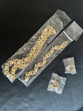 XOXO Gold Tone Bracelet and Matching Necklace, hearing, ring, and bracelet).